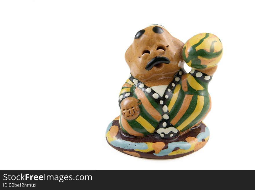 Traditional Uzbek ceramic figurine of a happy man with melon. Traditional Uzbek ceramic figurine of a happy man with melon