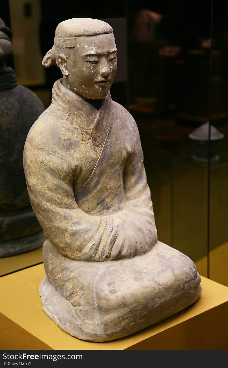 The Chinese terracotta soldier meditates in a prayer. The Chinese terracotta soldier meditates in a prayer