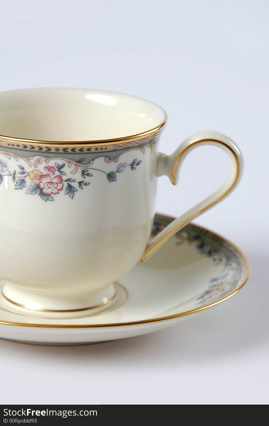 Close Up of Fine China Cup and Saucer over a white background