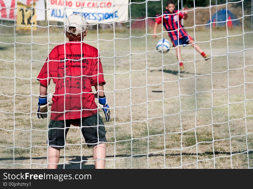 A penalty between two boys. A penalty between two boys