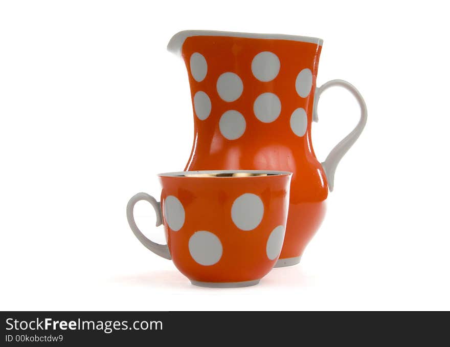 Red jug and cap on white background