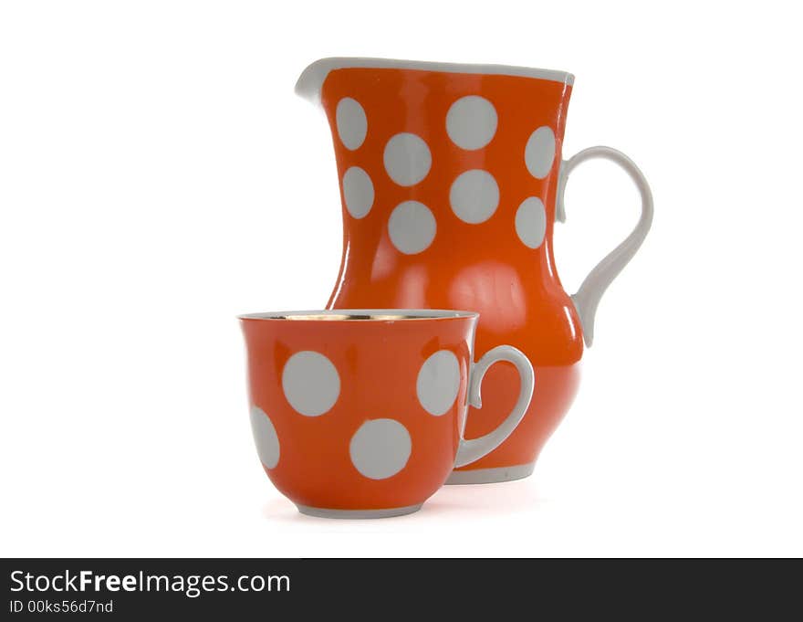 Red jug and cap on white background