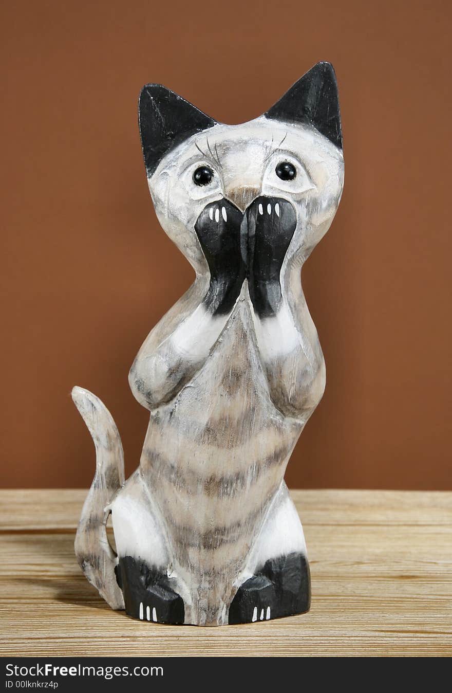 Home decoration trinket - wooden Siamese cat figurine. Home decoration trinket - wooden Siamese cat figurine.