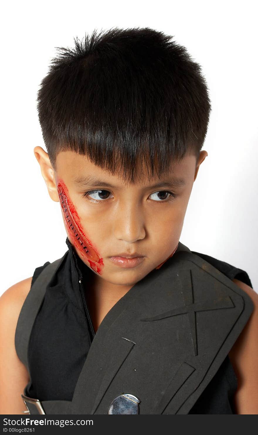 A boy disguised in halloween over a white background. A boy disguised in halloween over a white background