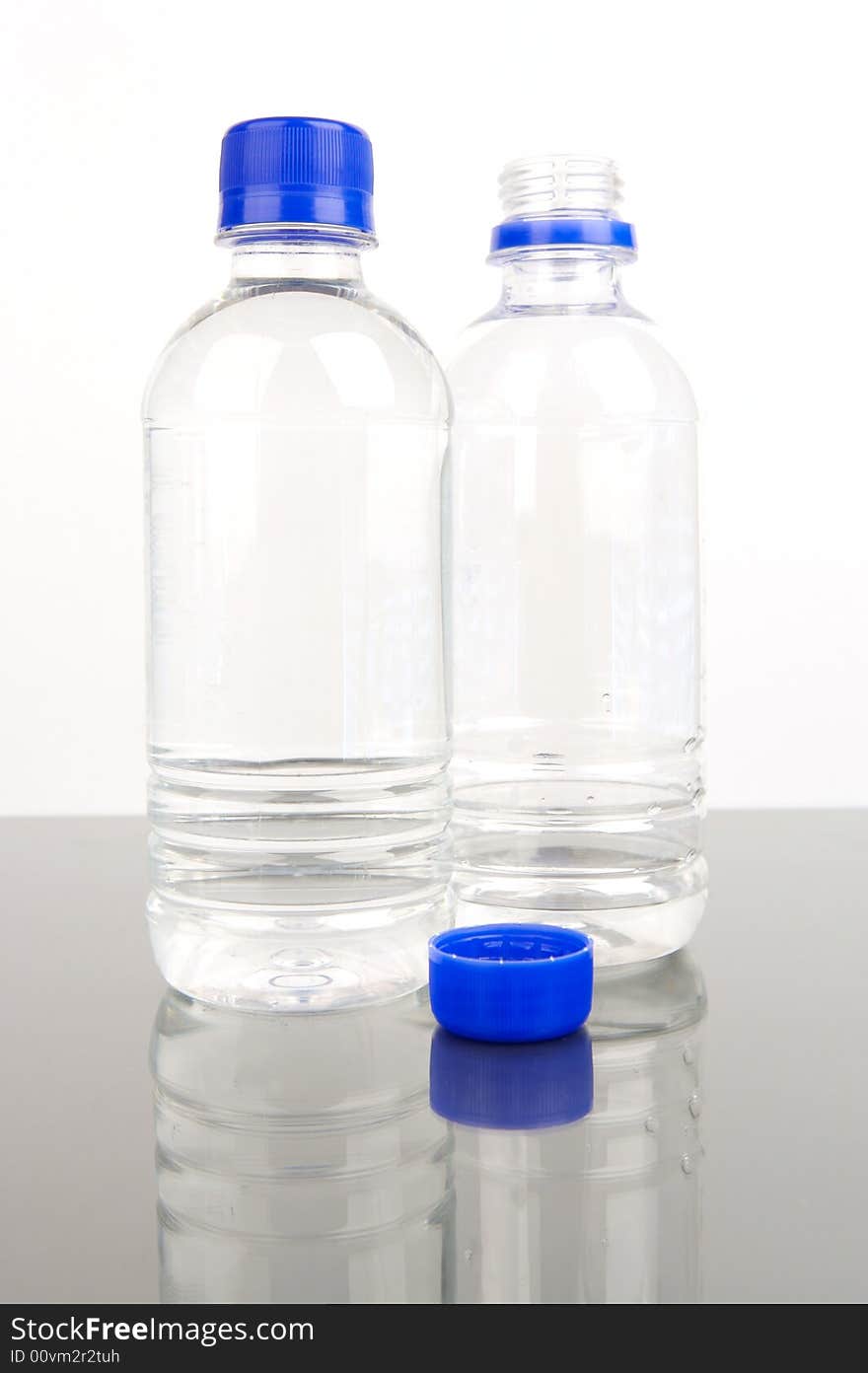 Bottled drinking water isolated against a white background. Bottled drinking water isolated against a white background