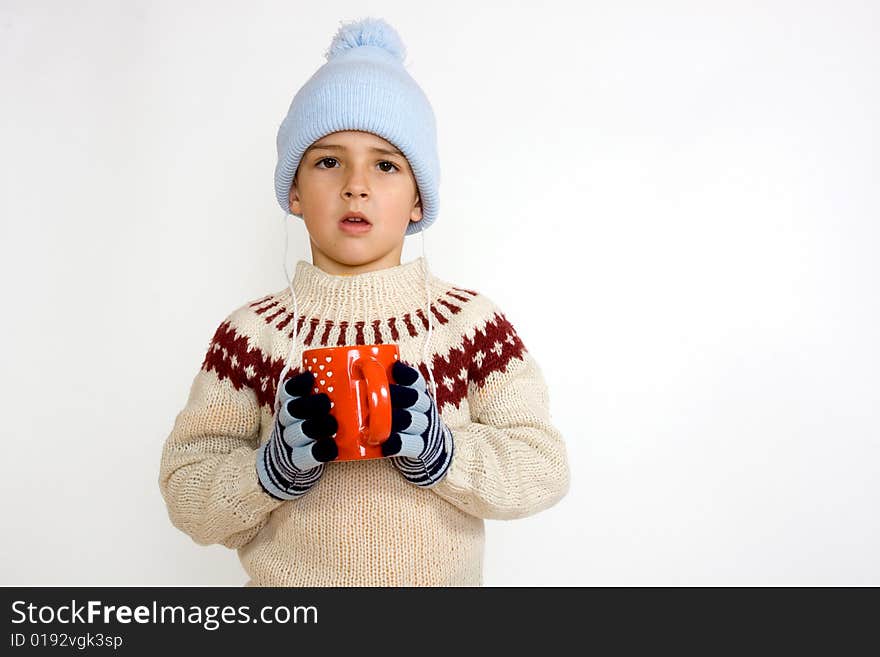 Little boy with cup of hot tea