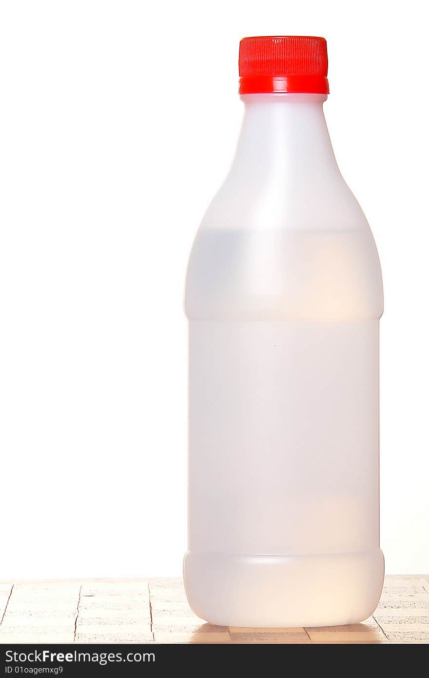 Transparent bottle over white background. Isolated image