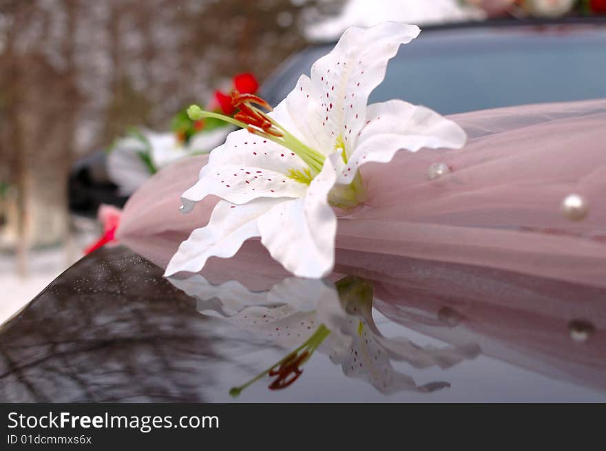 Wedding decoration (flowers) on black limousine car. Wedding decoration (flowers) on black limousine car.