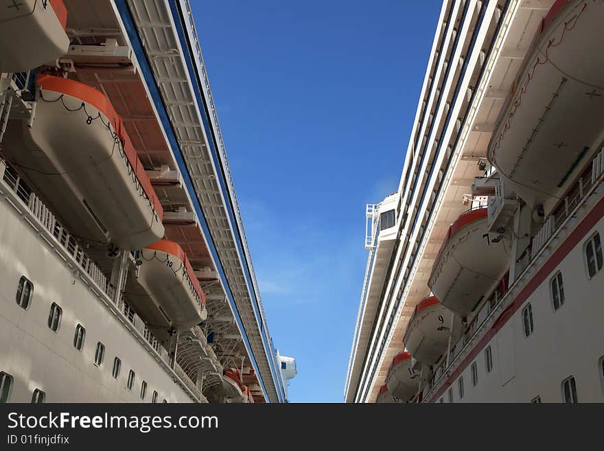 Close up of two passenger cruise ships in dock at resort island in the caribbean. Close up of two passenger cruise ships in dock at resort island in the caribbean