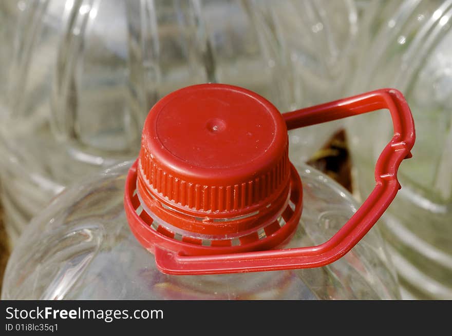 Large bottle of water with red cap. Large bottle of water with red cap