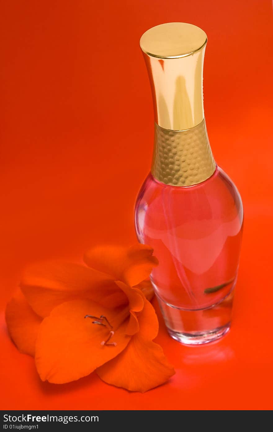 Beautiful bottle of perfume with flower