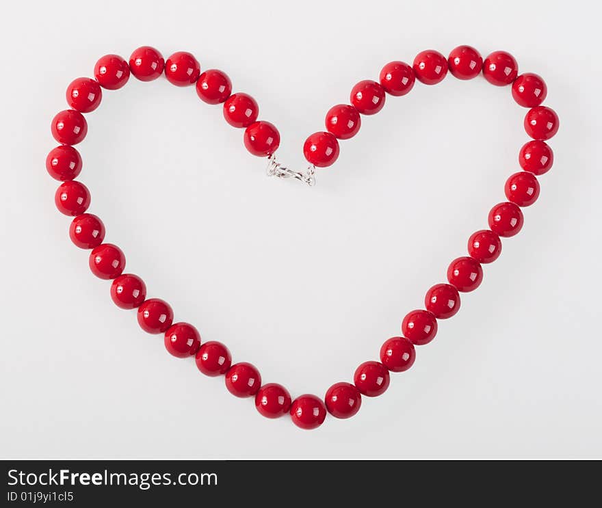 Heart from red mardi gras beads