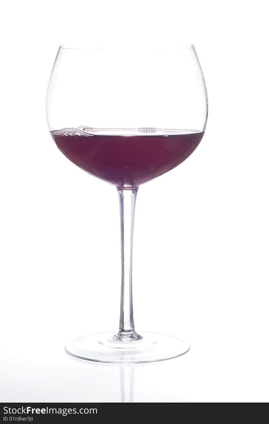 Glass of red beverage