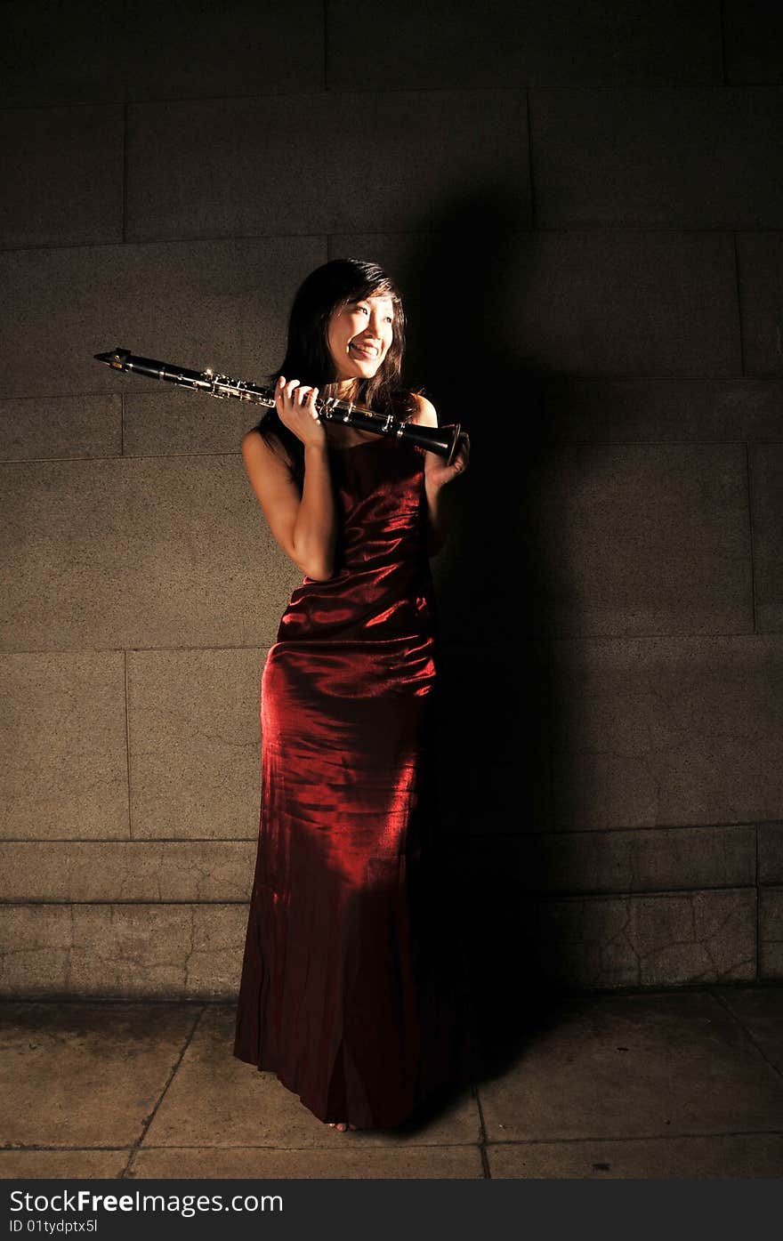 Beautiful Chinese Woman holding musical instrument