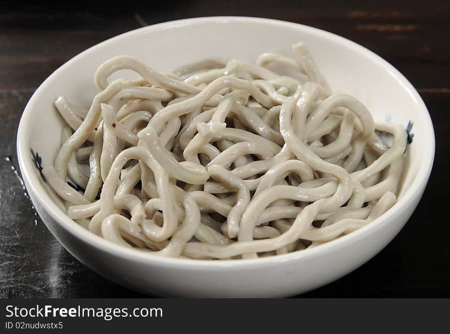 Udon noodles on the white table