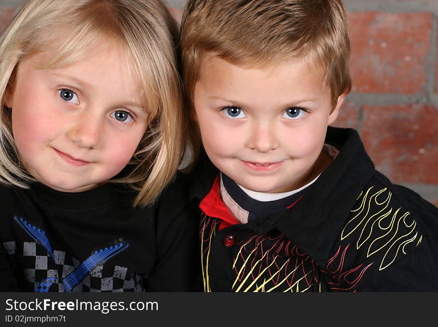 Beautiful young girl with blond hair and her cute boy friend. Beautiful young girl with blond hair and her cute boy friend