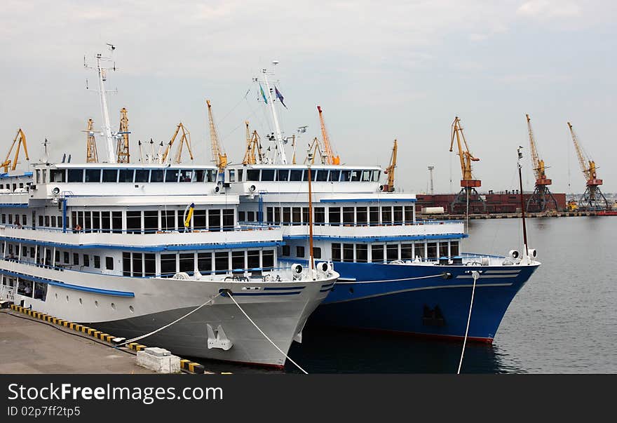 Stern of white and blue cruise ships. Stern of white and blue cruise ships