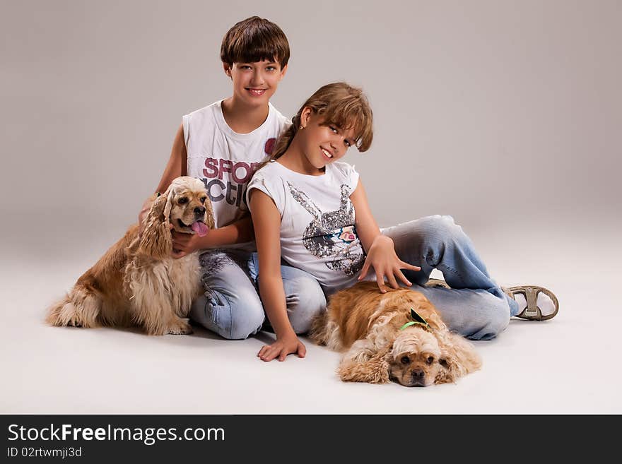 Boy and girl with dogs on isolated background. Boy and girl with dogs on isolated background