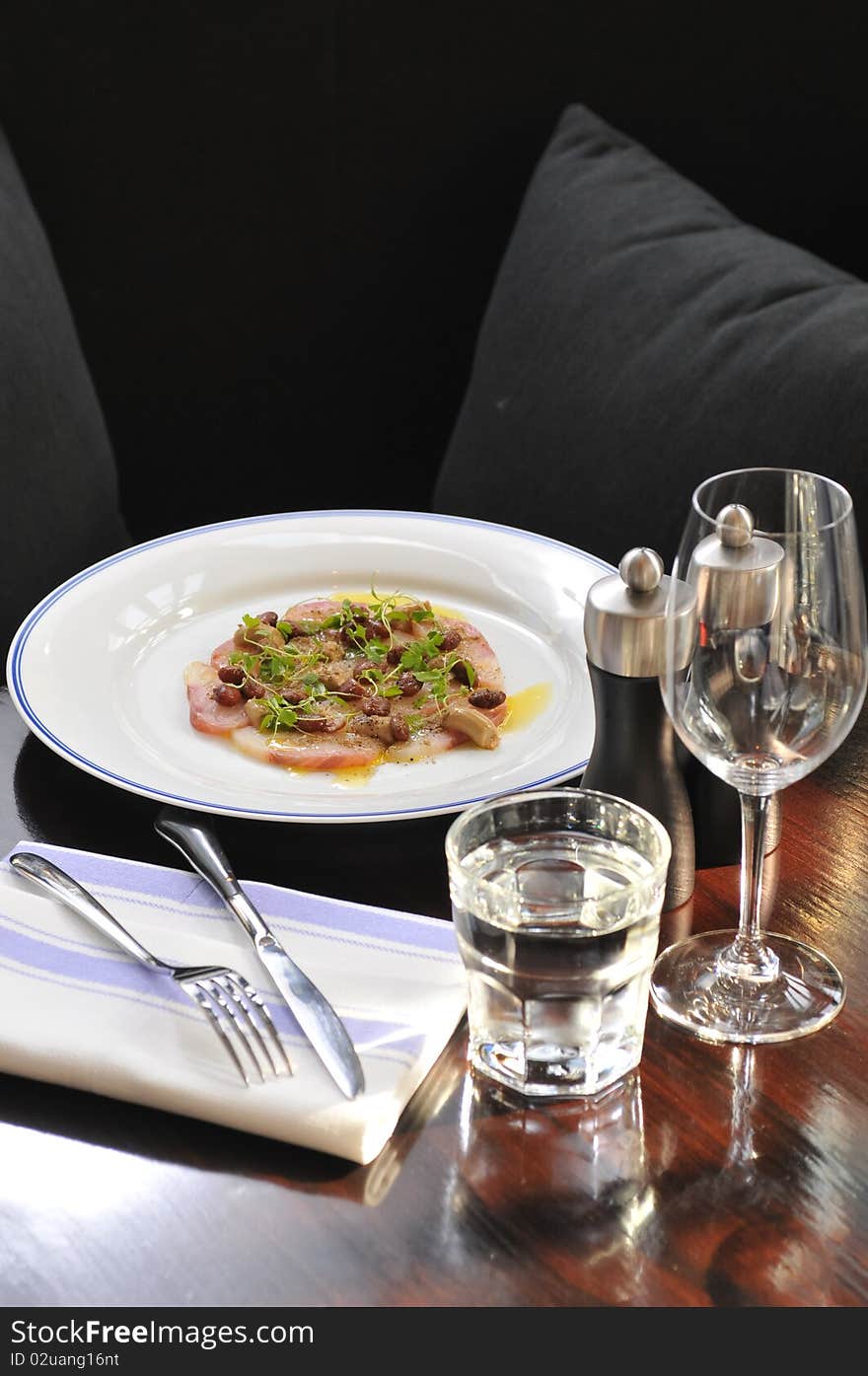 Amberjack carpaccio on table