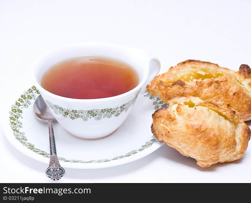 Tea and pies of puff pastry.