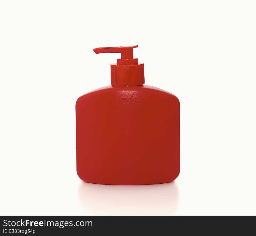 Red bottle of liquid soap on a white background