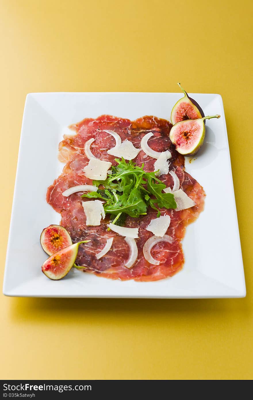 Carpaccio beef on yellow