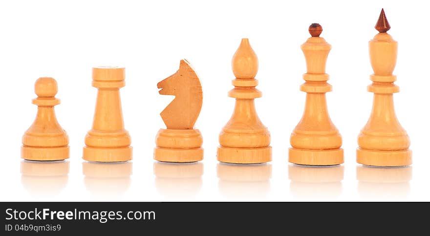 Chess. a group of white wooden chess pieces