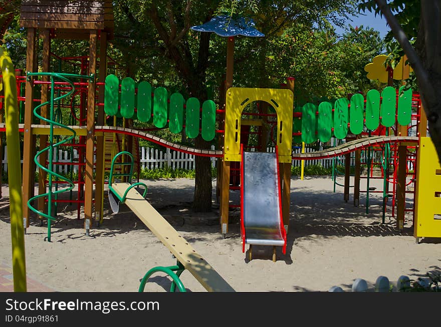 Fine playground with various attractions among trees