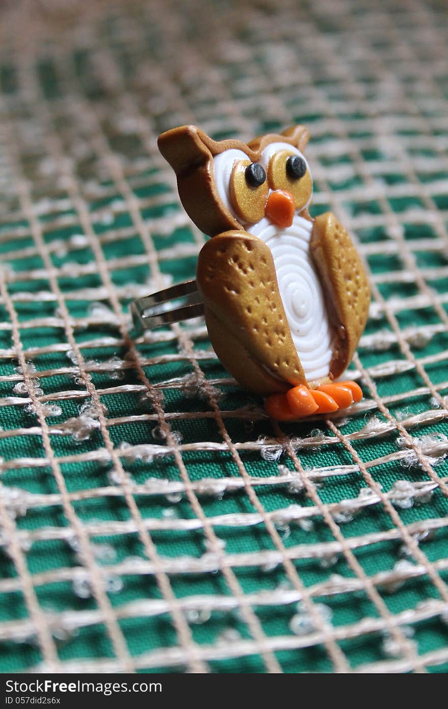 Golden owl from polymer clay. Golden owl from polymer clay