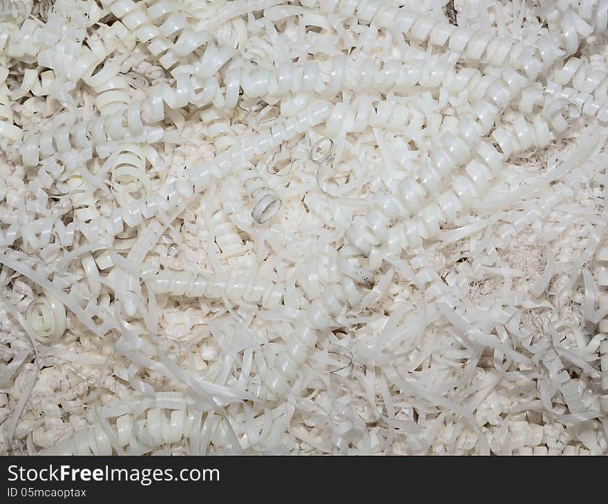 A pile of shavings from the polymer making up about the machine tool. A pile of shavings from the polymer making up about the machine tool