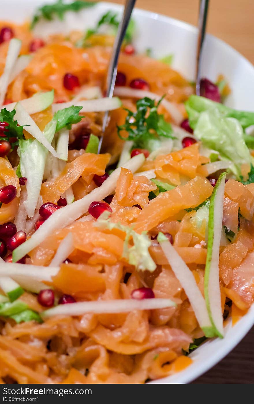 Smoked salmon, pomegranate and pears salad close-up. Smoked salmon, pomegranate and pears salad close-up