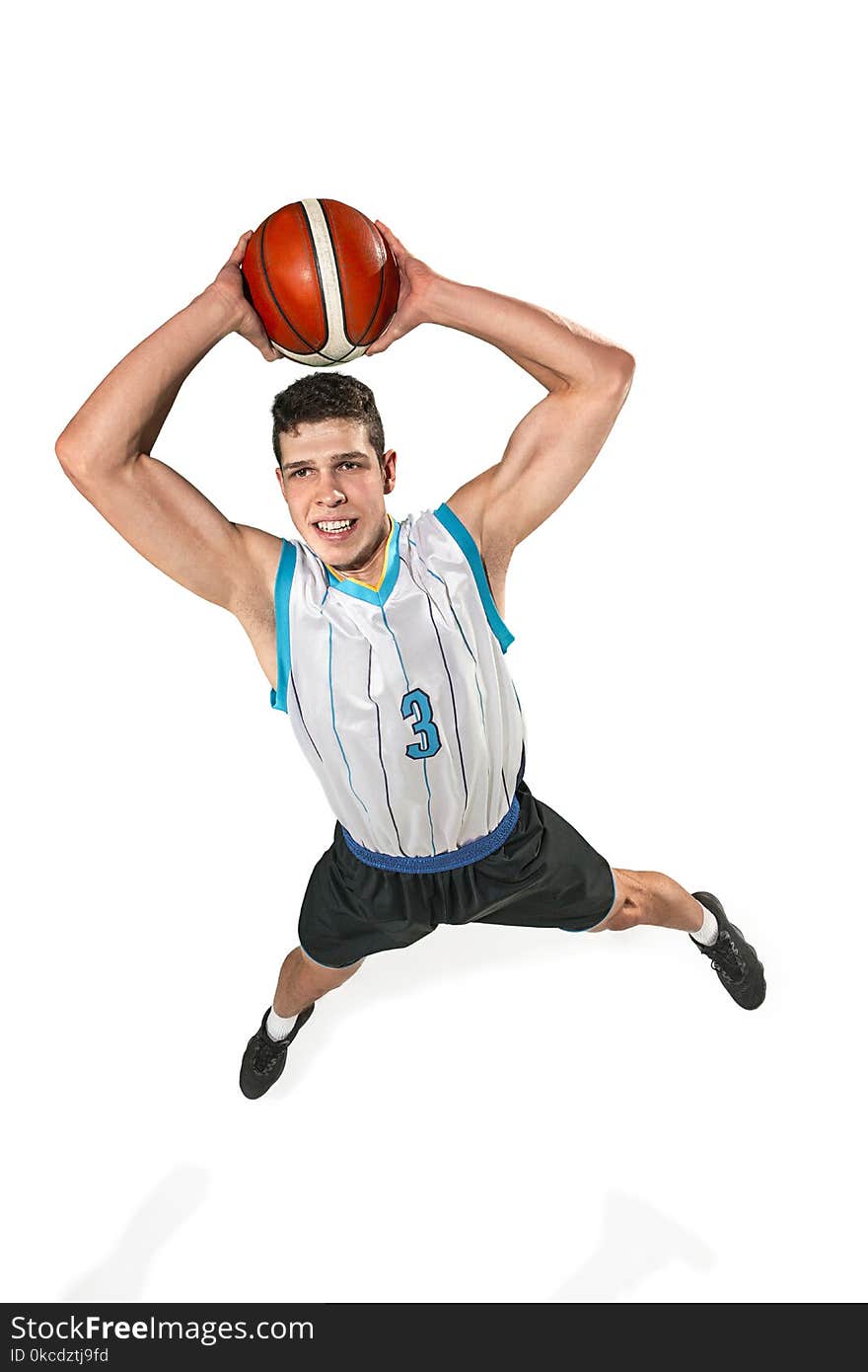 Full length portrait of a basketball player with ball