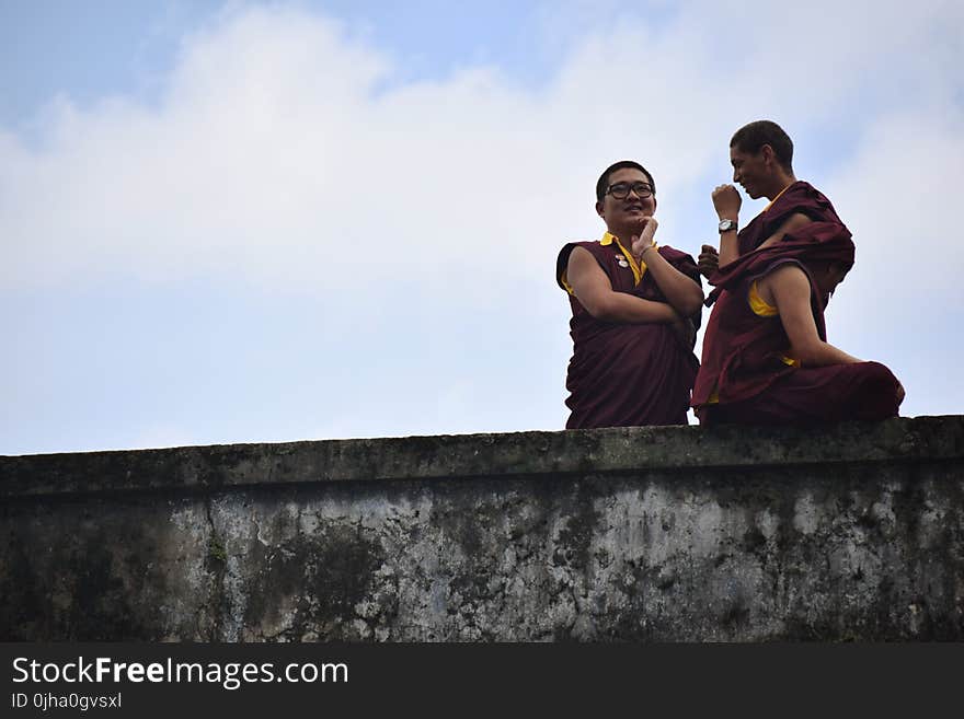 Photography of Three People Talking to Each Other