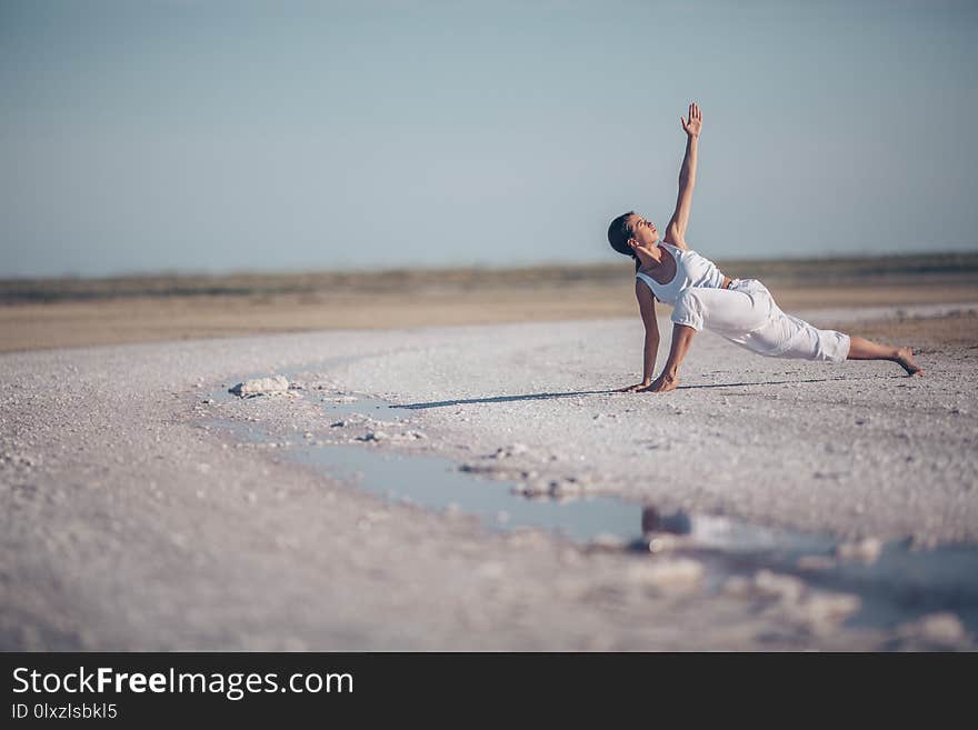 Young woman practicing yoga outdoors