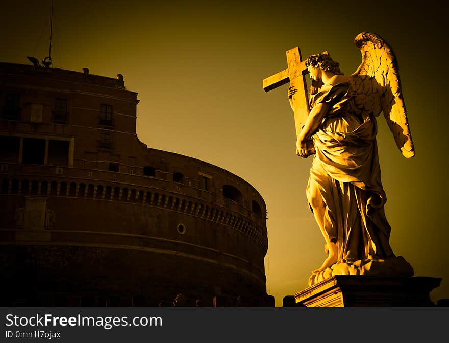 Rome, statue of an angel on the bridge in front of Castel Sant`Angelo. Conceptual useful for spirituality, christianity and faith. Rome, statue of an angel on the bridge in front of Castel Sant`Angelo. Conceptual useful for spirituality, christianity and faith.