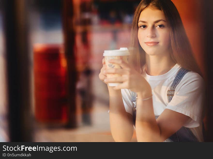 Young attractive pretty girl at cafe with coffee relax at mornin