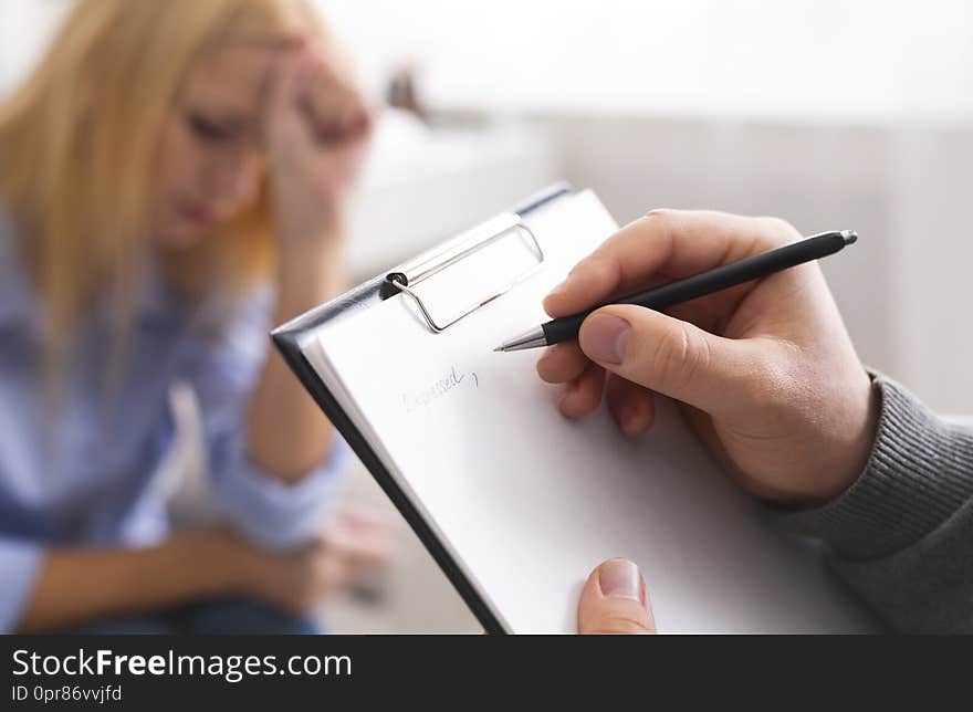 Psychological diagnosis. Professional skillful psychologist taking notes, listening to her patient, empty space. Psychological diagnosis. Professional skillful psychologist taking notes, listening to her patient, empty space