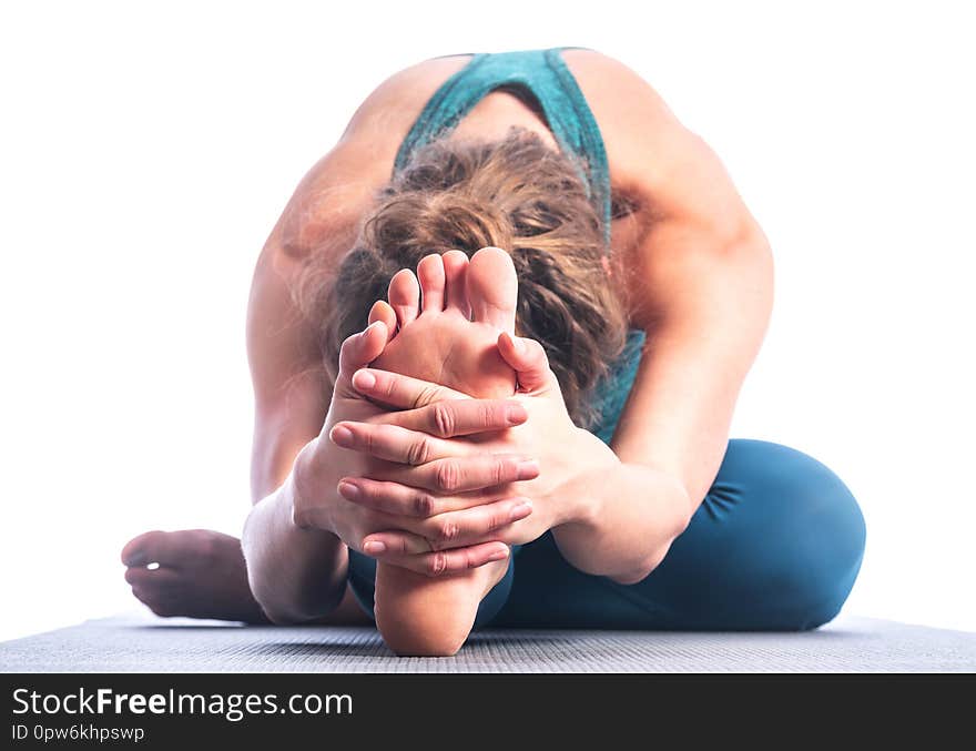 Athletic young blonde woman doing yoga practice isolated on white background. Concept of sport - healthy life and natural balance between body and spiritual development