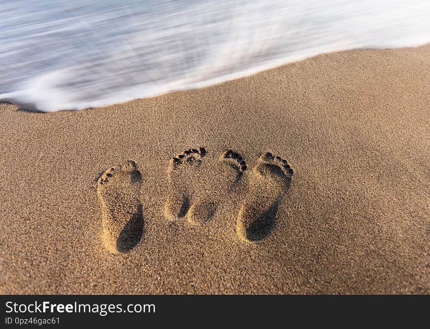 Footsteps of love on the sand. Footsteps of love on the sand