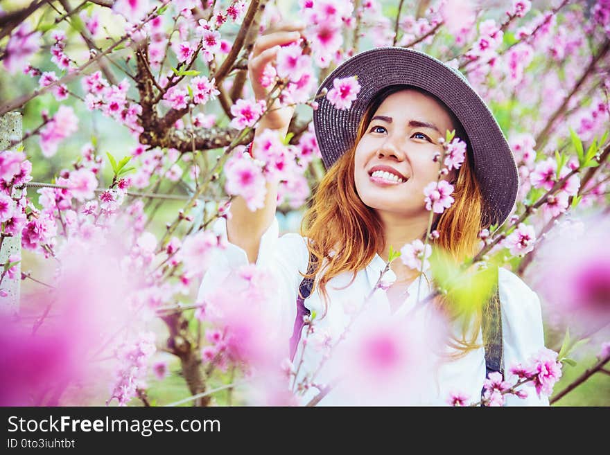 Woman asian travel nature. Travel relax. photographed in a flower garden