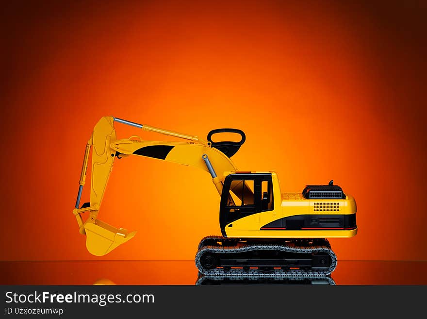 excavator model on orange background