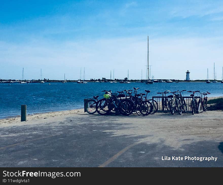 Bicycles, best source of travel on Martha`s Vineyard, bicycle.. rent or own, view of lighthouse from the ferry parking lot. beautiful blue water, ocean, sand, beach, good food, good fun, laughs, relax, unwind, meditate, just not on bike. Bicycles, best source of travel on Martha`s Vineyard, bicycle.. rent or own, view of lighthouse from the ferry parking lot. beautiful blue water, ocean, sand, beach, good food, good fun, laughs, relax, unwind, meditate, just not on bike