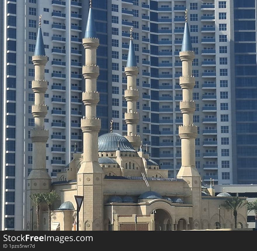 A masjid (mosque) is a place of worship in Islam, where Muslims gather for prayers, spiritual reflection, and community activities. It is considered a sacred space dedicated to the worship of Allah. The masjid typically features key elements such as a prayer hall, a mihrab (niche indicating the direction of Mecca), a minaret (tower for the call to prayer), and sometimes a courtyard or a dome. Beyond prayer, masjids often serve as centers for education, charity, and social gatherings. They play a central role in the lives of Muslims, fostering both individual and collective spiritual growth.