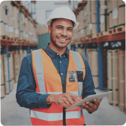 Manufacturing sector. A young man is using a tablet.