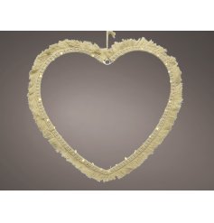 A stunningly simple heart shaped wire LED decoration set with a Macrame tassel finish and warm glowing LED light 