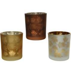 Sure to bring an Autumnal Woodland feel to any home space, a mix of glass candle pots with leaf motifs 