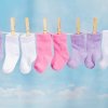 Pairs of Baby Socks on a Clothesline