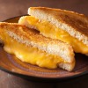 A grilled cheese sandwich made with American block cheese.