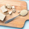 Two different types of yeast on a cutting board.