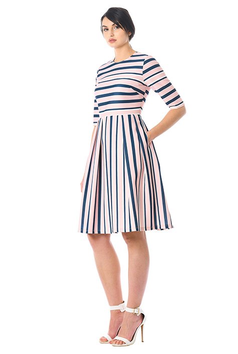 Stripes add modern attitude to our scuba knit dress in a flattering fit-and-flare silhouette for day-to-evening versatility.